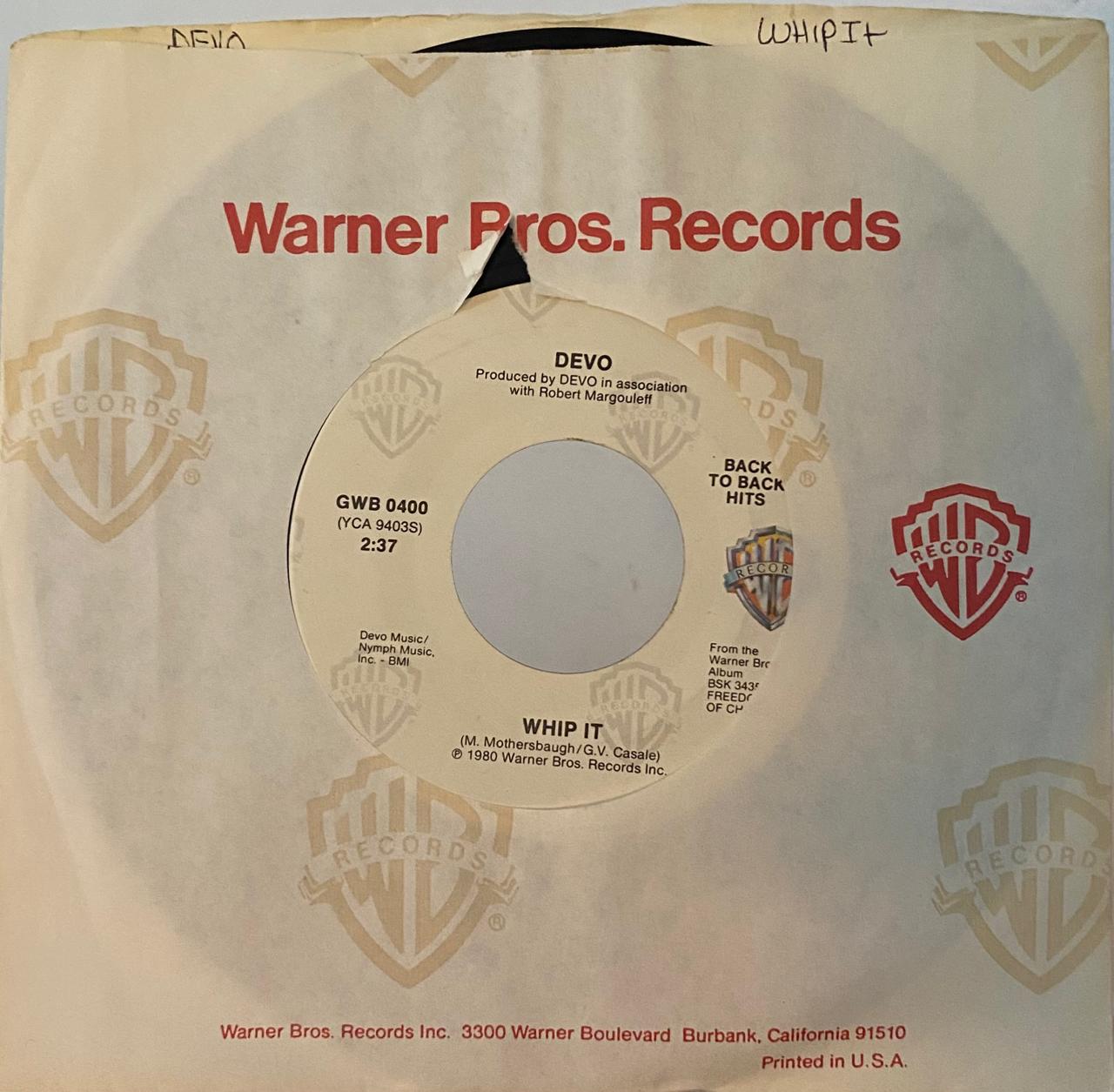 Devo – Whip It / Girl U Want (7", usado, EE.UU.)